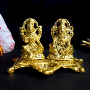 Beautifully Crafted Laxmi and Ganesh with Diya